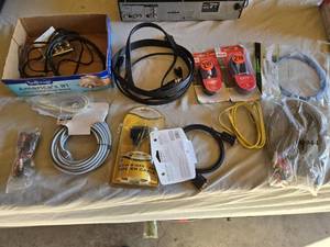 lot 153 image: Various audio, video, and network cables, including RCA stereo audio cables, CAT6 network cables, VGA extension cables, USB printer cables, and more.