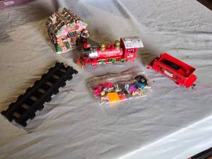 lot 239 image: Rudolph Train Set and Accessories including Track, Figures, and Gingerbread House - Untested