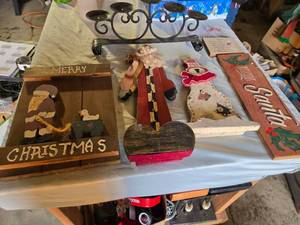 lot 249 image: Christmas-themed decorations including Santa signs and candle holder, plus holiday decor items
