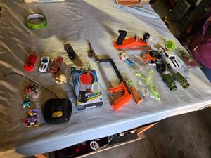 lot 282 image: Mixed Toy including Beyblade Slingshock, Black & Decker Toy Hacksaw, and Hot Wheels Cars