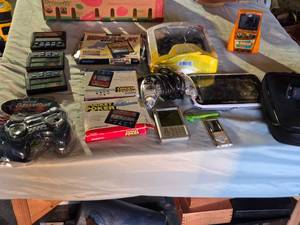 lot 288 image: Lot of Electronic Handheld Games and Accessories including Radica Pocket Poker and Pocket Keno, LeapFrog LeapPad, and Psylone PS2 Controller