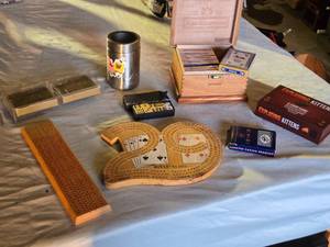 lot 289 image: Games including Cribbage Boards, Exploding Kittens Card Game, and AON Safety First Playing Cards