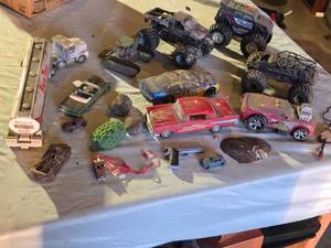 lot 299 image: Assorted Toy Vehicles and Accessories Lot including Monster Trucks, Cars, and Tank