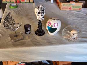 lot 305 image: Decorative Halloween Skull and Feather Decor Set including Skeleton Candle Holder, Sugar Skull Stand, and Glass Bowl