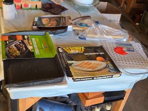 lot 312 image: Nordic Ware Double Backsplash Griddle, Microwave BaconMeat Rack, and Crofton 11-Inch Grill Pan