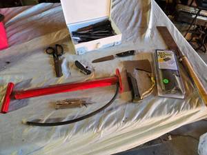 lot 453 image: Gerber Hatchet, Gun Cleaning Kit, Bike Pump and Variety of Household Knives