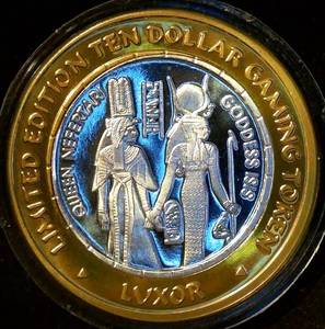 lot 34 image: 2000 Luxor Gaming Token, Low Mintage Nefertari & Isis, Lulvnv#22, Mint Fresh, .60 ASW 999 Silver