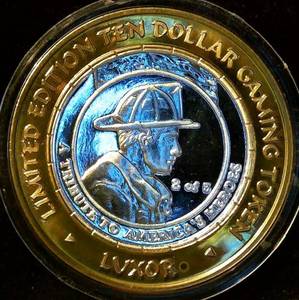 lot 35 image: Scarce 2002 Firefighter Tribute - Americas Heroes, Mint Fresh Luxor Gaming Token, Lulvnv#46, .60 ASW .999 Silver