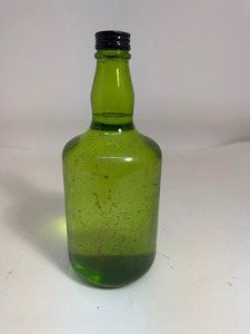 lot 22 image: Vintage Green Glass Bottle with Original Cap AND Liquid