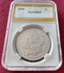 lot 117 image: 1899 Morgan Dollar PGA MS63 - Tough Date