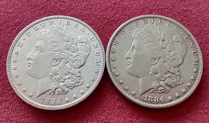 lot 119 image: (2) 1884 Morgan Dollars