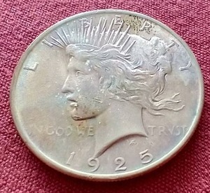 lot 150 image: 1925 Peace Dollar - Toned