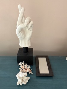 lot 20 image: White Hand Sculpture on Black Base with Coral Accents and Display Mirror Frame