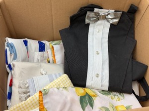 lot 141 image: Lemon-Print Table Linens Textiles & Black Dress Shirt Apron