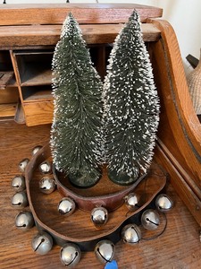 lot 207 image: Snow-Dusted Bottle Brush Christmas Trees - Set of 2, Green with Snow Tips and Jingle Bells on Leather strip