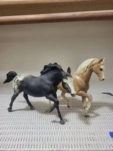 lot 106 image: Plastic Horse Figurines - Black & Tan (Lot of 2)