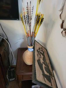 lot 176 image: Arrows in Wicker Vase - Archery Arrow Display with Yellow Fletching