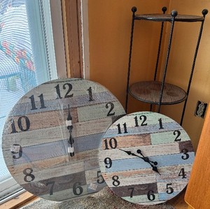 lot 251 image: Left of Hutch - Round Clock Face Panels - Distressed Wood Wall Decor (Set of 2) and 3 tiered shelfplant stand with black metal frame (lot of 3 items)