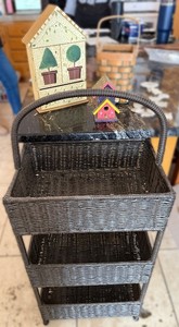 lot 252 image: Right of Hutch - Wicker 3-Tier Storage Cart with Handle - Birdhouse Decor & Wind-Chime Set