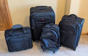 lot 129 image: UL - 4-Piece Black Luggage Set - DELSEY, Swiss Gear & Polo Sport Travel Bags
