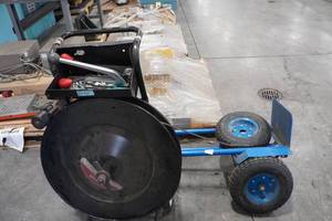 lot 730 image: Strapping Dispenser Cart with Tool and 2 Wheel Dolly - Bad Wheels