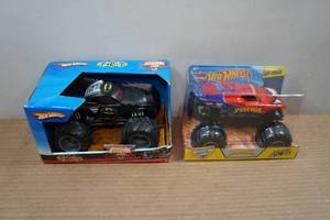 lot 105 image: Hot Wheels 124 Scale Monster Jam Trucks - Batman & Spider-Man