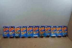 lot 143 image: 11 Vintage Hot Wheels Tattoo Machines Series