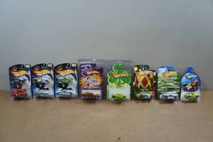lot 144 image: Assorted Hot Wheels - Halloween Highway, Mardi Gras, Clover Cars