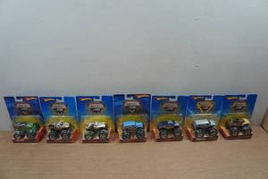 lot 173 image: 7 Hot Wheels Monster Jam Trucks - Early - Taz, Dalmatian, Grave Digger