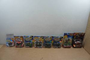 lot 174 image: 8 Hot Wheels Monster Jam Trucks - Zombie Special, Speed Demon, Duo