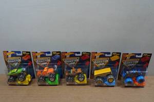 lot 180 image: 5 Hot Wheels Monster Jam Trucks - with Stunt Ramps