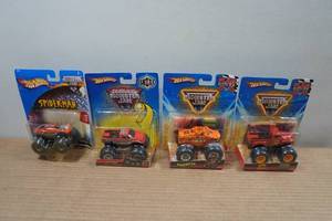 lot 213 image: 4 Hot Wheels Monster Jam Trucks - Flag Series, Shoxx