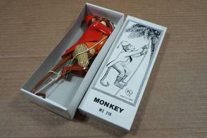 lot 217 image: Vintage Look Tin Litho Climbing Monkey