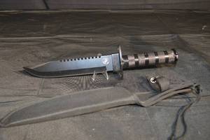 lot 84 image: Marine Corps Combat Knife - Serrated Edge, Knurled Grip, Black Sheath