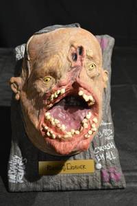 lot 340 image: The Ruckus Crusher Monster Bust Prop - Open-Mouth Creature on Rock Base
