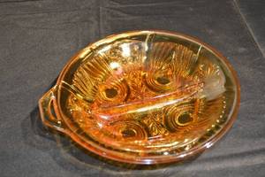 lot 342 image: Amber Carnival Glass Bowl - Pressed Swirl Pattern With Rim Handle