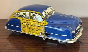 lot 81R image: LR - Walt Reach Tin Car Toy by Cortland