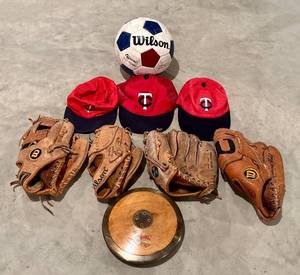 lot 226H image: LL - Wilson Soccer Ball, 3 Minnesota Twins Hats, 4 Vintage Baseball Gloves & Wood Discus