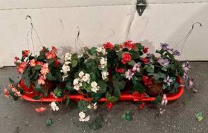 lot 523H image: G - Four Planters on Red Sled - 46-in Long Floral Display