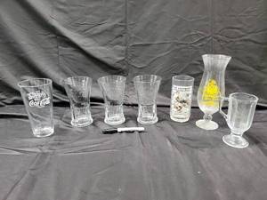 lot 97 image: 8-Piece Coca-Cola Glassware Lot - Coke Tumblers, The Saturday Evening Post Glass, Hurricane