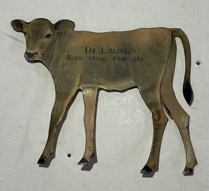 lot 52 image: Vintage De Laval Tin Cow Calf Cutout Advertising