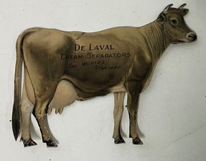 lot 89 image: De Laval cream separator advertising die-cut tin cow vintage