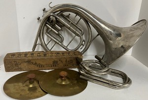 lot 141 image: Antique Player Piano Paper Music Roll in Box and Vintage Instruments Brass Cymbols Trombone