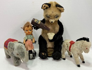 lot 276 image: Vintage Antique Wind Toys Drinking Panda