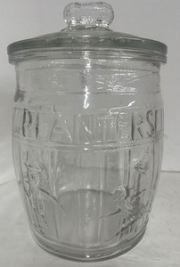 lot 67 image: Planters Peanut Clear Glass Barrel Jar with Lid Adveritisng Mr. Peanut