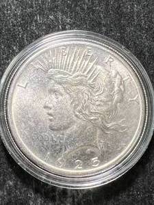 lot 56 image: 1925 US PEACE SILVER DOLLAR IN AIRTITE
