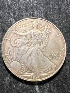 lot 64 image: 1998 AMERICAN SILVER EAGLE 1 TROY OZ .999 FINE SILVER