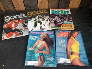 lot 10 image: Very Collectible vintage Minnesota North Stars Game Programs, Sports illustrated Swim Suit issues, and More