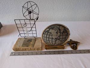 lot 14 image: Collection of 3 Desk Decor Pieces Incl. Metal Globe Bookend, Science Award Sculpture, and Cast Iron Bottle Opener