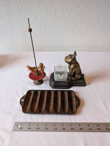 lot 24 image: Antique Cast Iron Griswold Corn Stick Pan, Brass Dog Inkwell, and Vintage Toy Spinner Trio